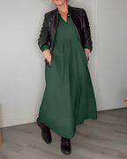 Long V-neck midi dress in dark green with black jacket, three-quarter sleeves
