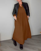 Long V-neck midi dress in brown with black jacket, three-quarter sleeves