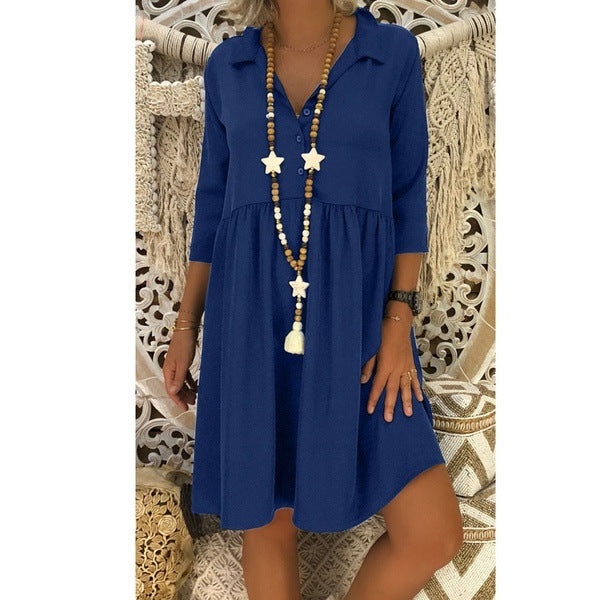 Blue cotton blouse dress with V-neck and elbow-length sleeves, gathered skirt