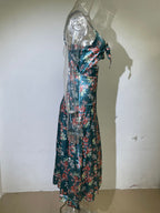 Teal floral georgette dress on mannequin with spaghetti straps and tie-front V-neck
