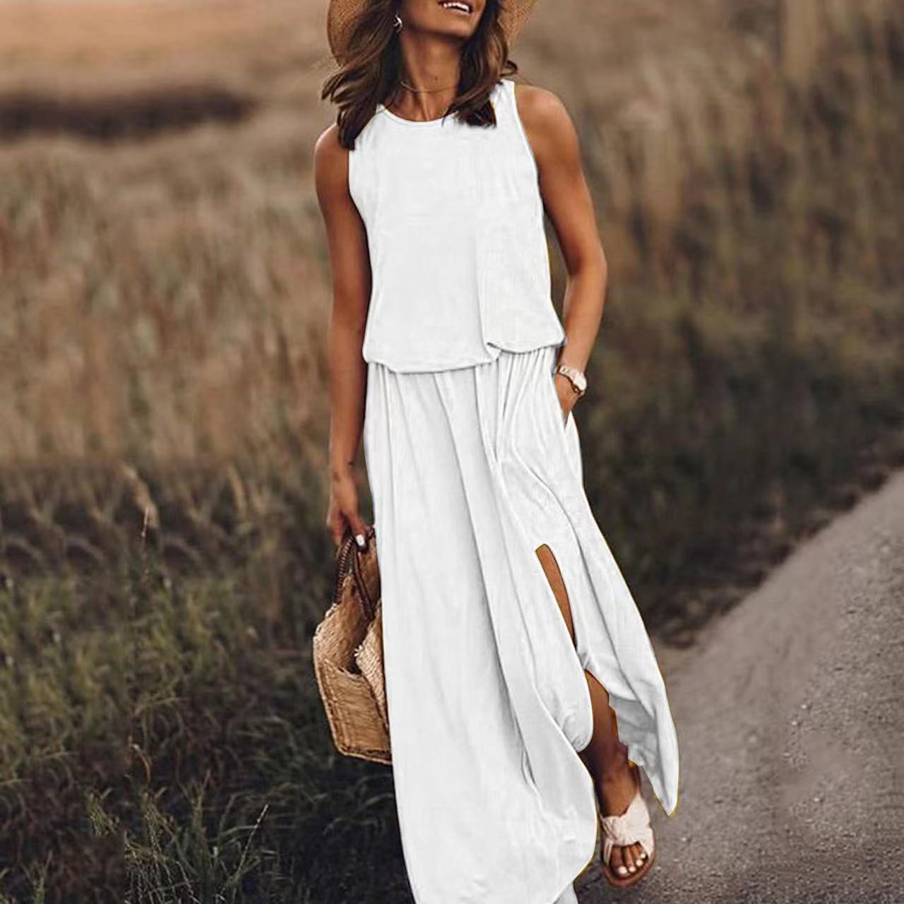 Sleeveless summer dress, white tiered bodice with loose skirt and side slit
