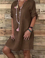 Brown cotton blouse dress with V-neck opening and short sleeves