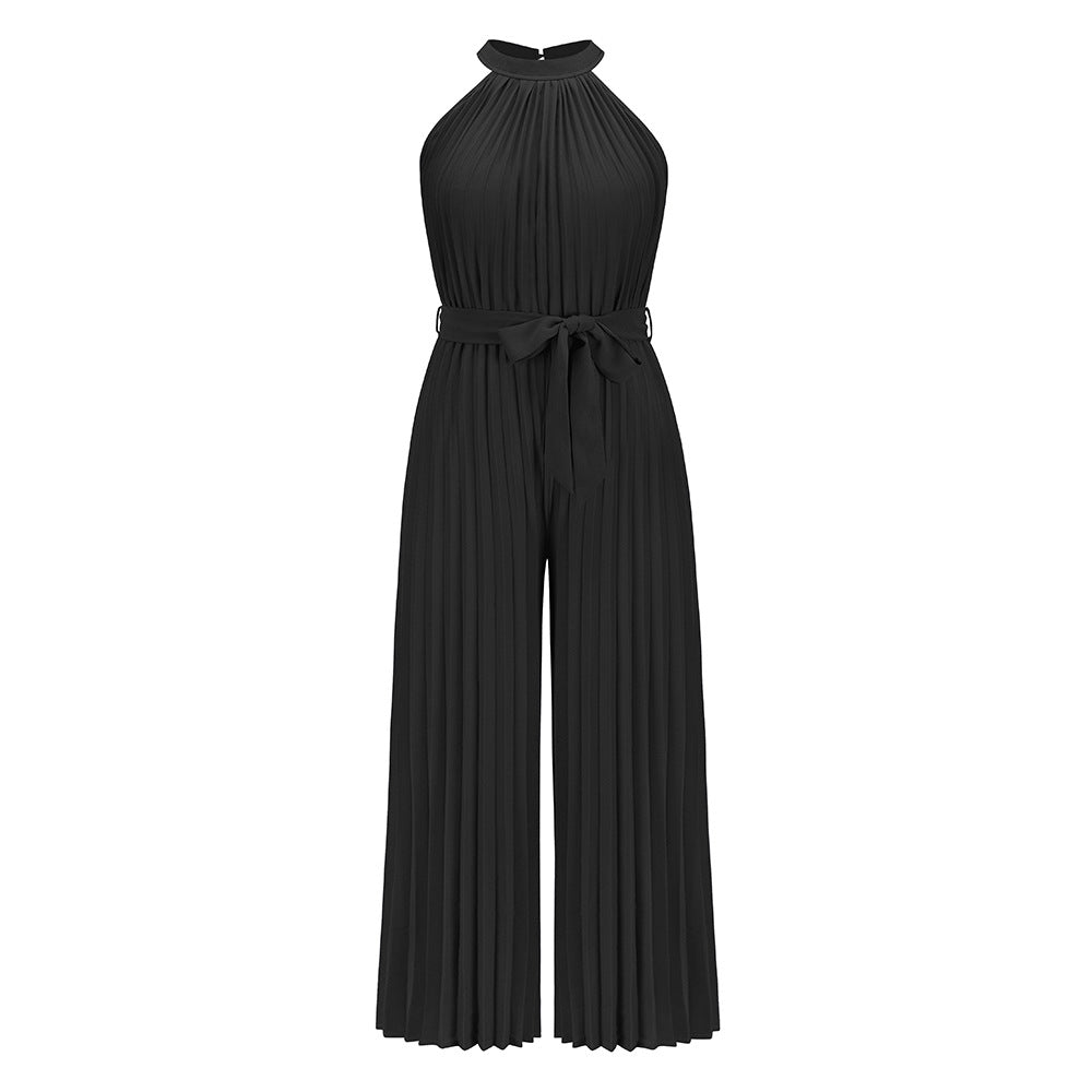 Black pleated halter jumpsuit with tied waist and wide-leg pants