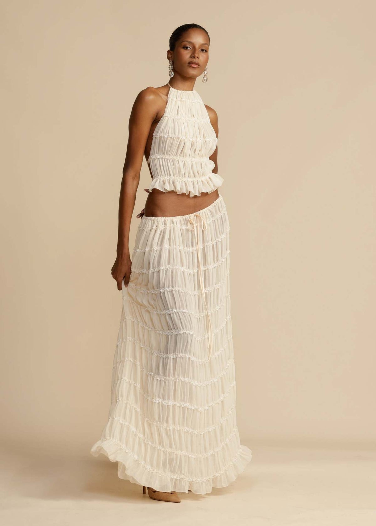 White tiered halter top and tiered maxi skirt set, front view with ruffle layers