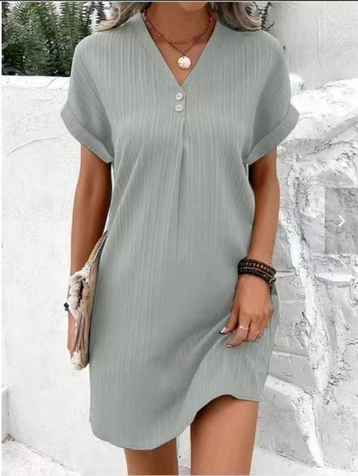 Light gray mini dress with V-neck button front, short sleeves, vertical stripe texture