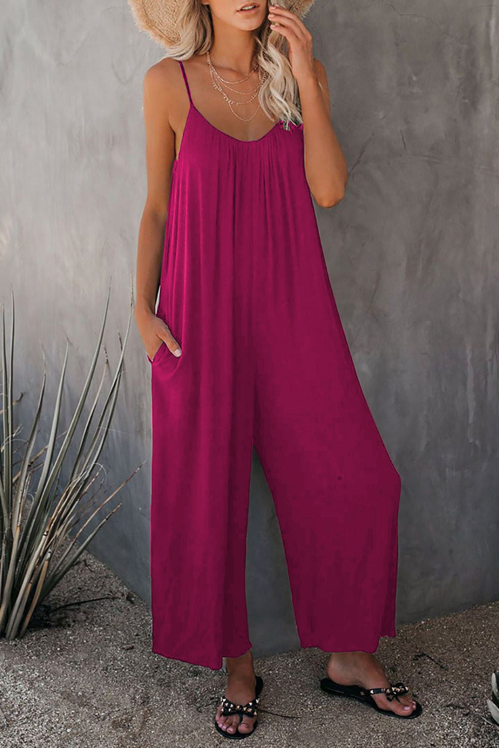 Wine red loose-fitting jumpsuit with spaghetti straps and wide-leg pants