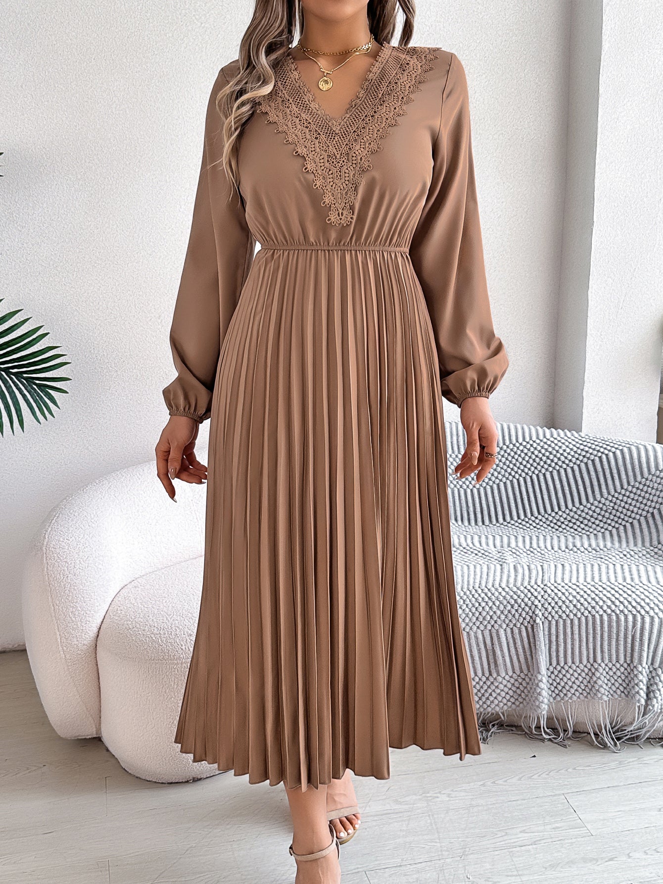 Pleated midi dress with long sleeves, V-neck, and lace trim in taupe
