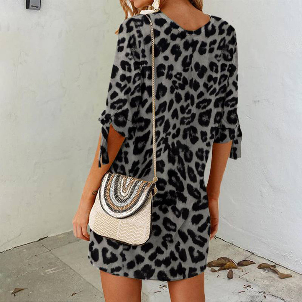 Leopard-print mini dress with round neck and three-quarter sleeves