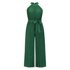 Green pleated halter jumpsuit with tied waist and wide-leg pants