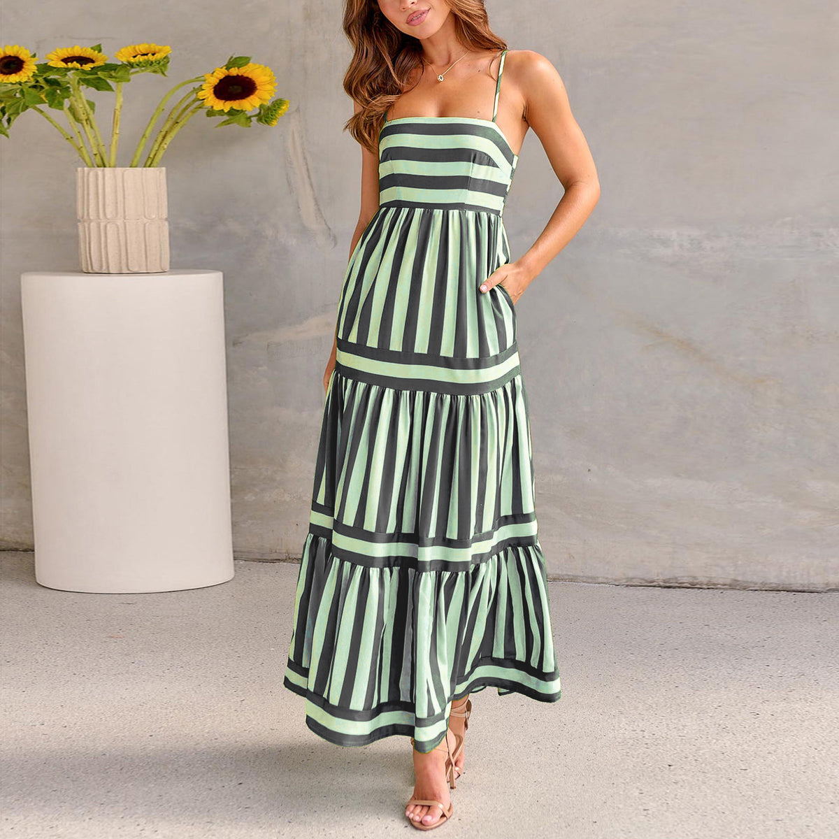 Dark green striped tiered maxi dress with spaghetti straps and layered skirt