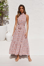 Peach halter long dress with small red floral print and gathered skirt