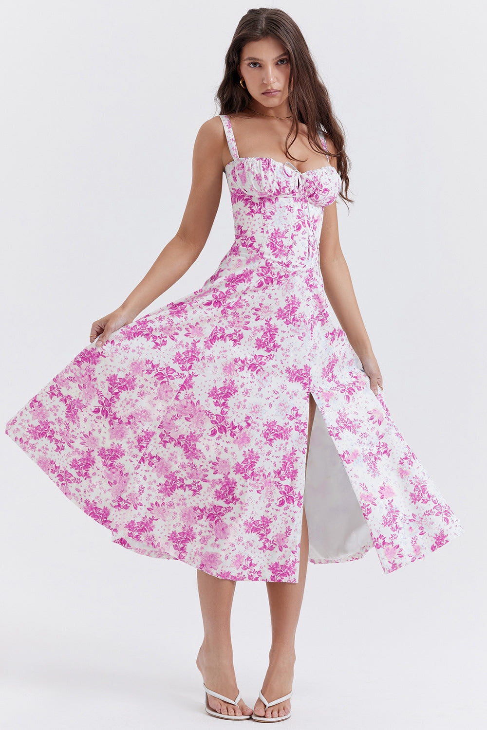 Elegant midi dress in pink floral print with ruched bust and flared skirt