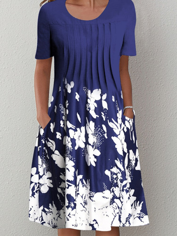 Casual floral dress in dark blue with white floral print, short sleeves, and round neckline