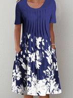 Casual floral dress in dark blue with white floral print, short sleeves, and round neckline