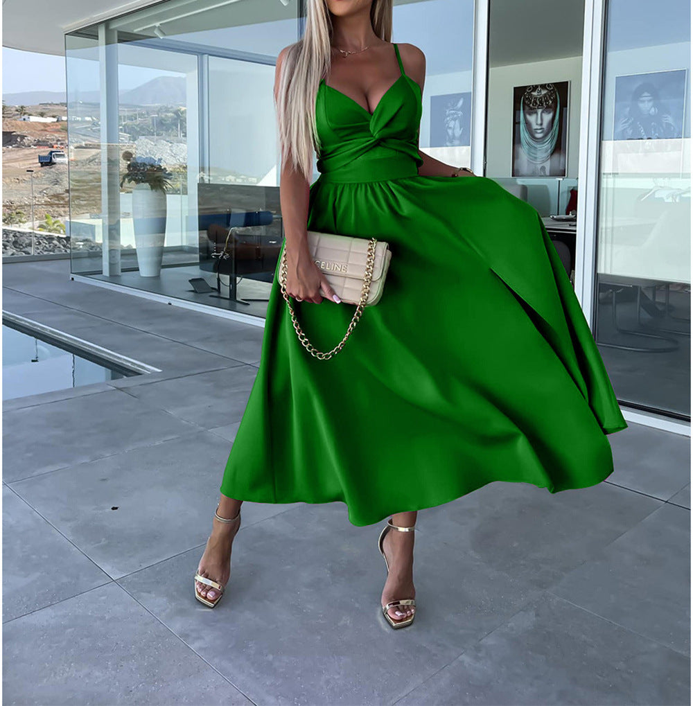 Green sleeveless midi dress with V-neck twist bodice and flowing skirt