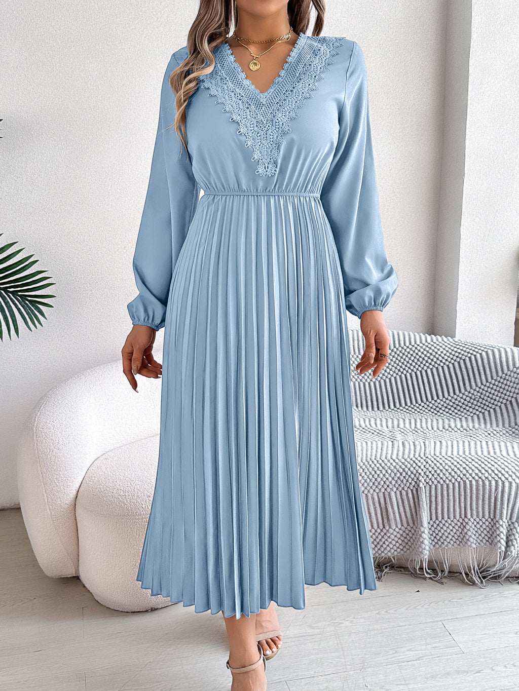 Light blue pleated midi dress with V-neck lace trim and long balloon sleeves
