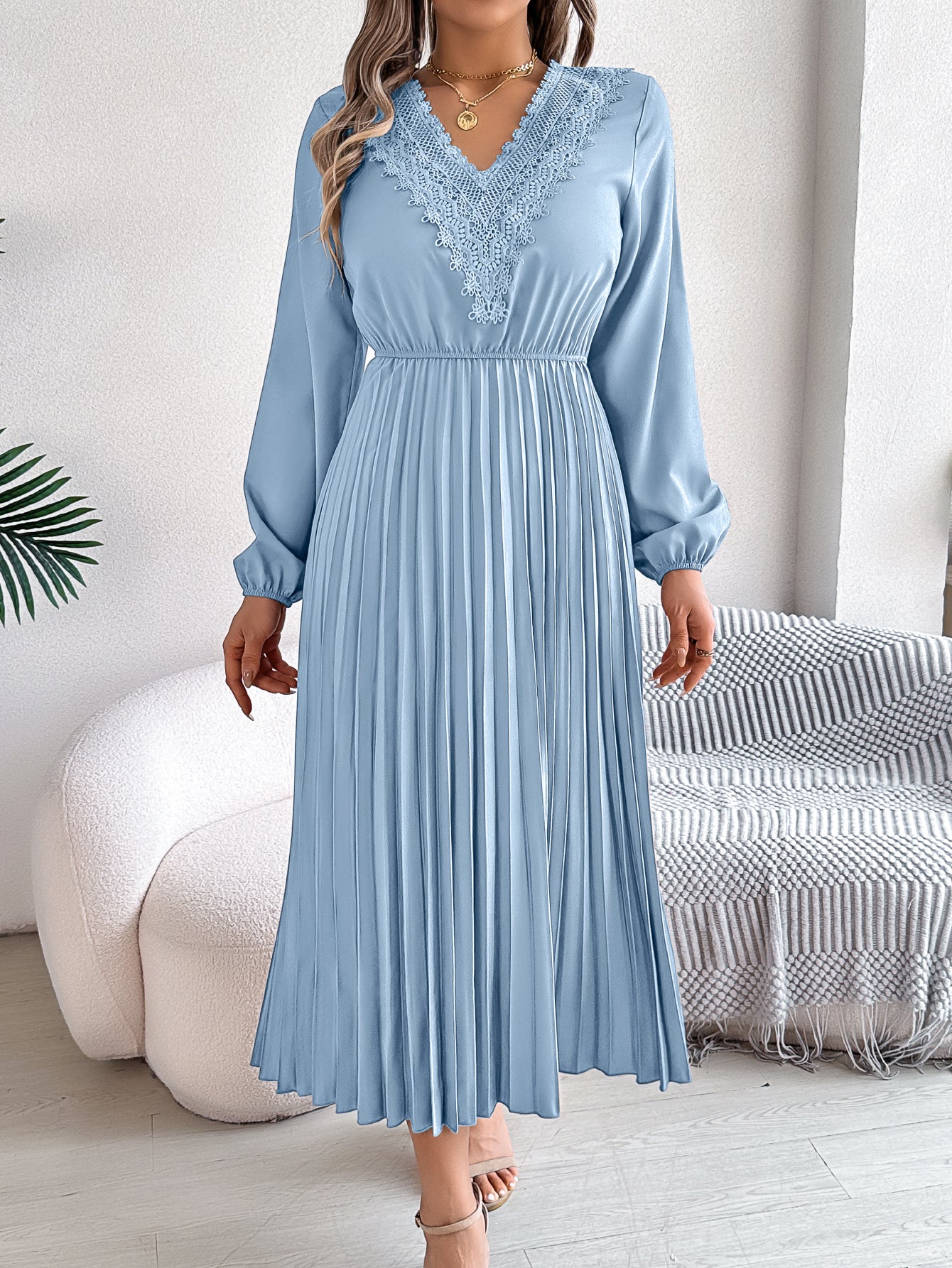Light blue pleated midi dress with V-neck lace trim and long balloon sleeves