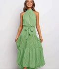 Green halter long dress with white dot print and tied waist detail