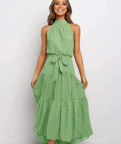 Green halter long dress with white dot print and tied waist detail