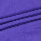 Purple textured fabric closeup with crinkle surface and soft drape