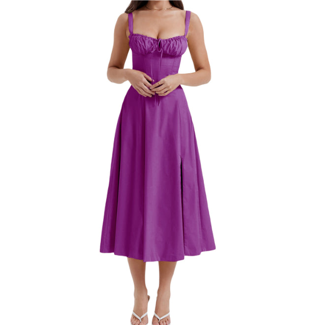 Purple mid-length dress with spaghetti straps, ruched bust, and flared midi skirt