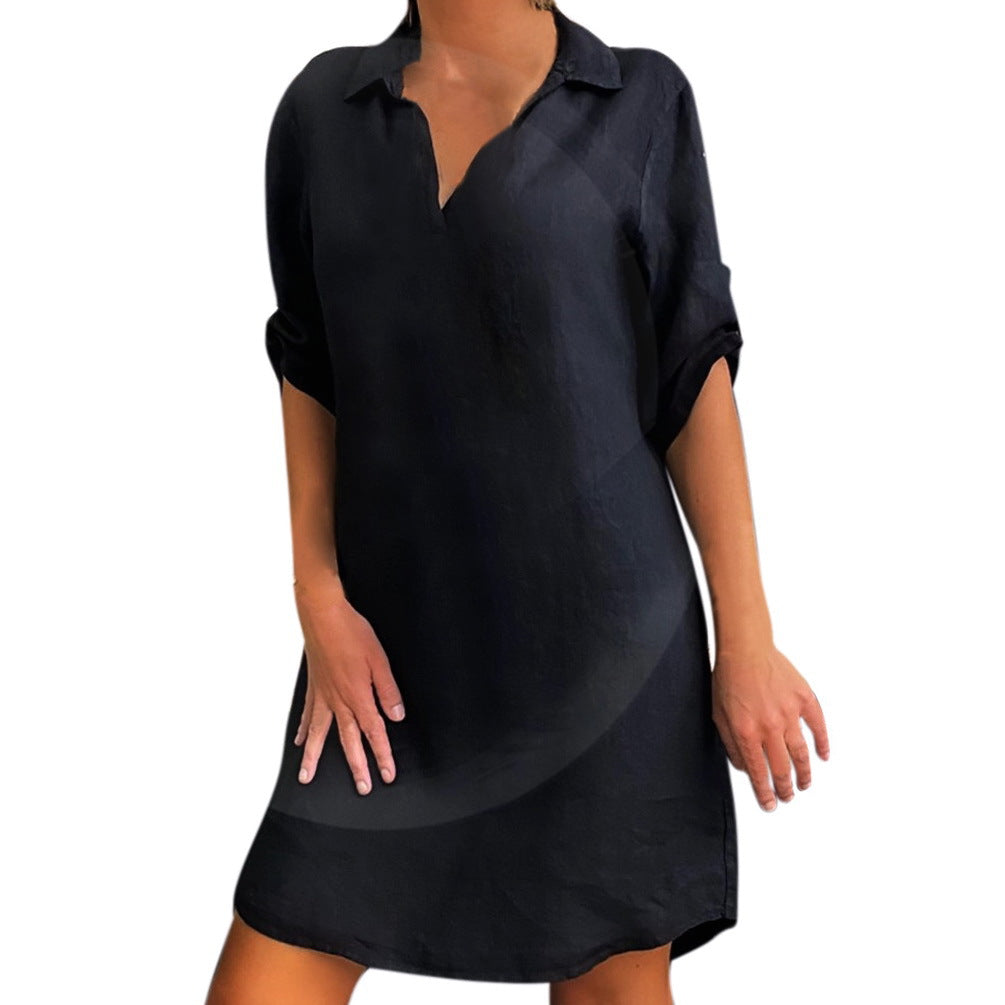 Black cotton blouse dress with collar, V-neck, and three-quarter sleeve length