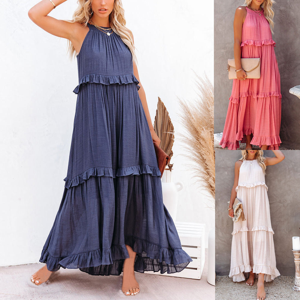 Dark blue sleeveless tiered maxi dress with ruffled layers and gathered neckline