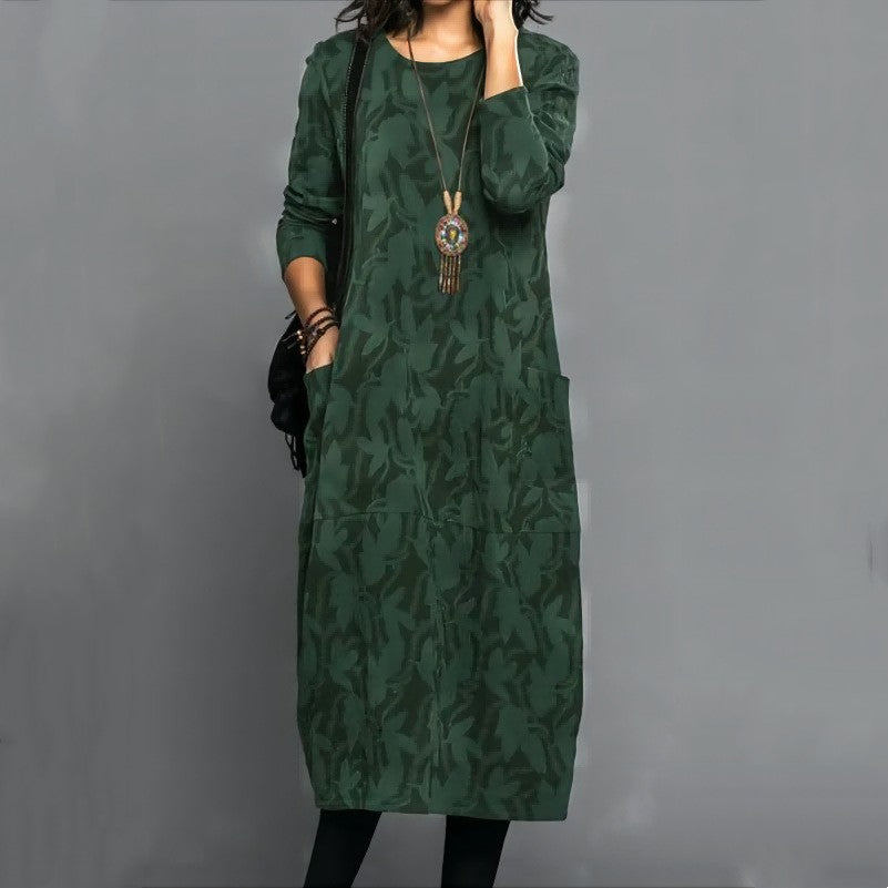 Stylish long green dress with abstract foliage pattern, long sleeves, round neckline