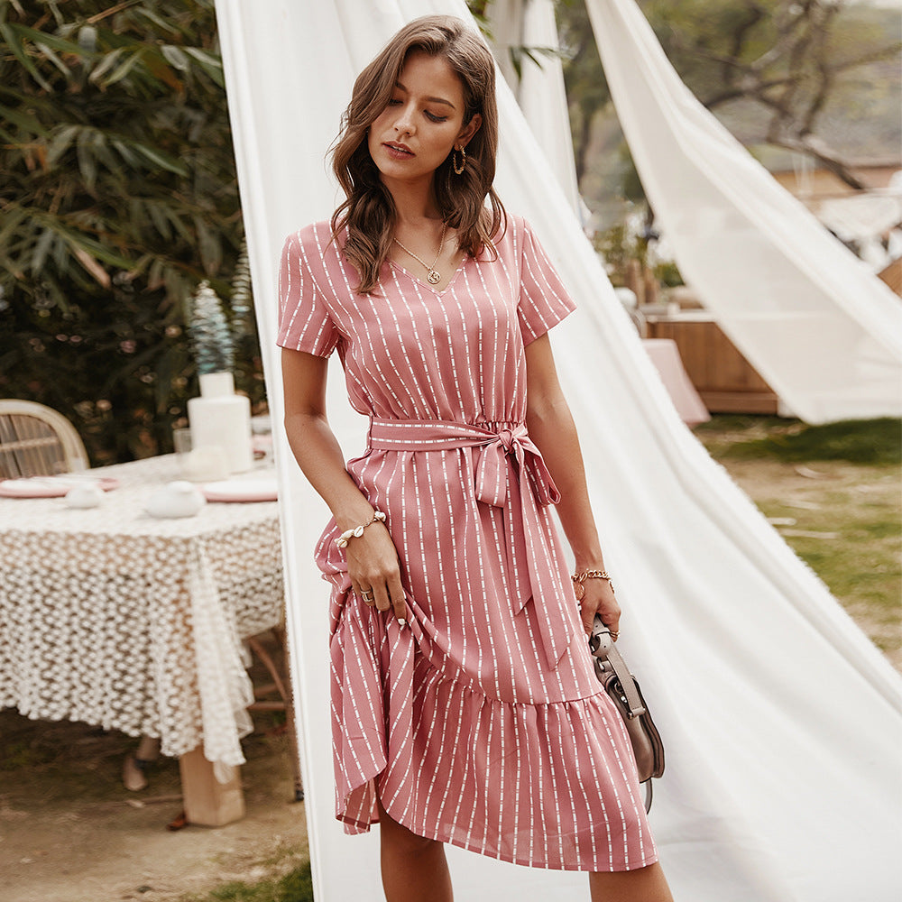 Pink striped midi dress with V-neck, short sleeves, and waist tie