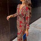 Red and tan patterned maxi dress with V-neck wrap and waist tie, long sleeves