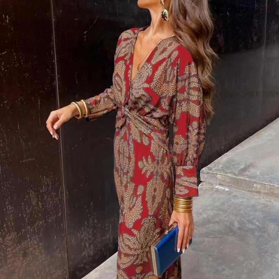 Red and tan patterned maxi dress with V-neck wrap and waist tie, long sleeves