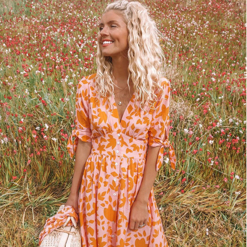 Orange leaf-print midi dress with V-neck button front, gathered waist, tie cuffs