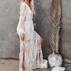 White embroidered sheer maxi dress with V-neck and flowing layered skirt