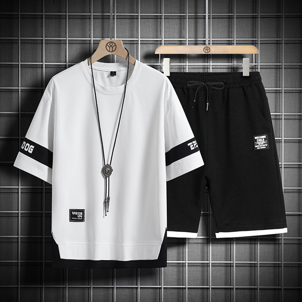 Men’s lounge set: white crewneck shirt and black drawstring shorts with long necklace