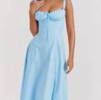 Light blue mid-length dress with spaghetti straps and gathered fitted bodice