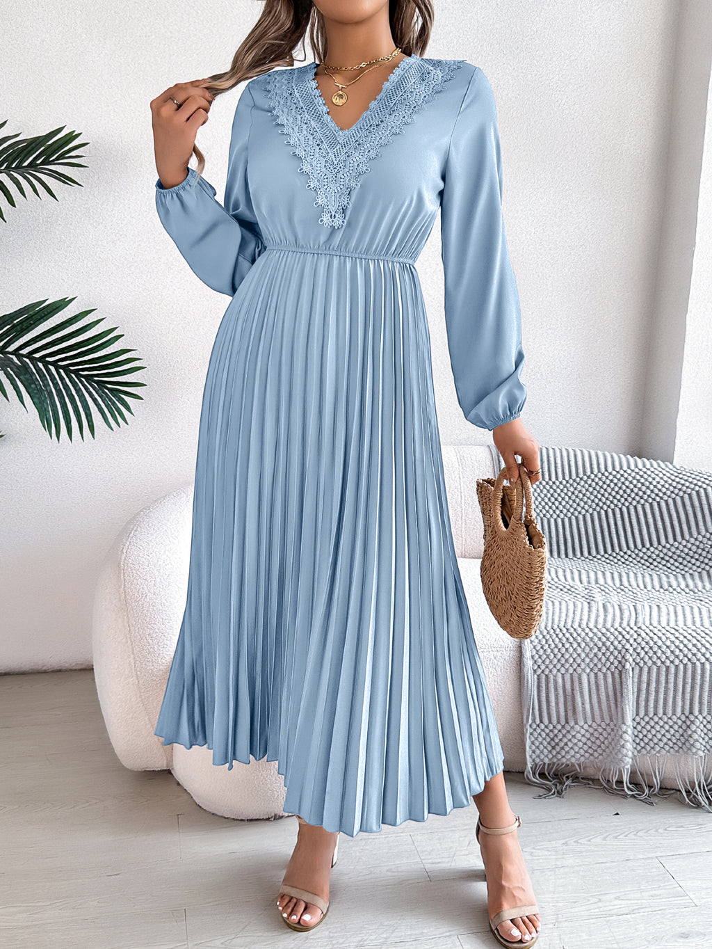 Light blue pleated midi dress with V-neck lace trim and long sleeves, belted waist