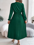 Green pleated midi dress with V-neck lace trim, long sleeves, gathered waist