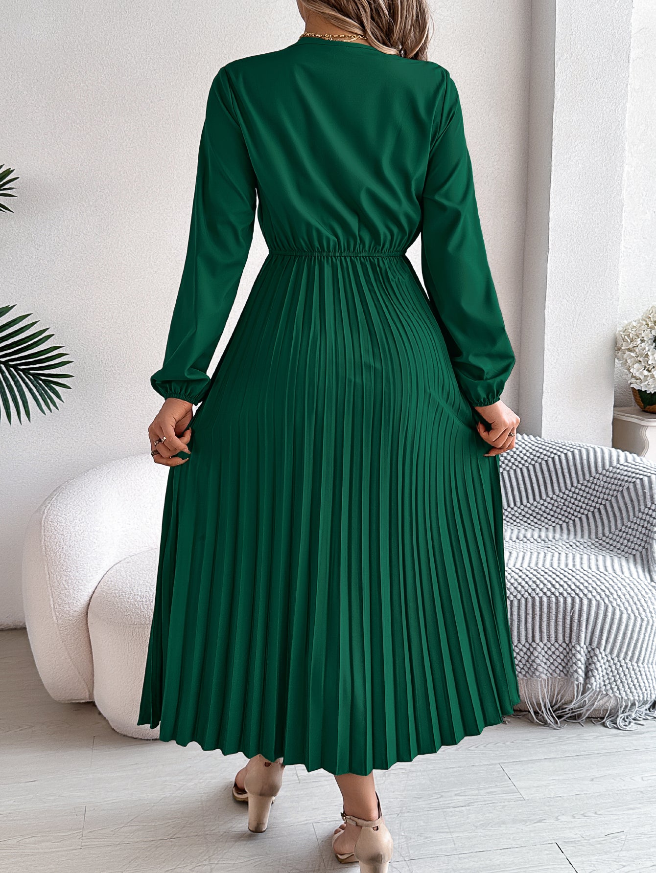 Green pleated midi dress with V-neck lace trim, long sleeves, gathered waist