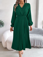 Green pleated midi dress with V-neck lace trim and long balloon sleeves