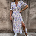 Floral maxi dress with V-neck, short puff sleeves, and front side slit
