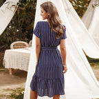 Navy blue striped midi dress, short sleeves, tiered hem, and waist tie