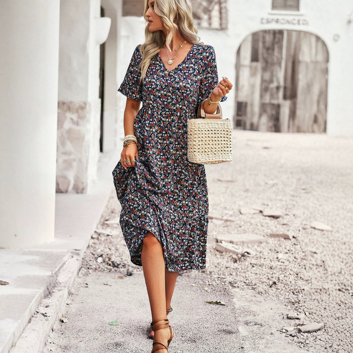 Floral V-neck midi dress in navy with short puff sleeves and gathered waist