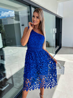 Blue one-shoulder mid-length lace cutout dress, close-up of textured floral cutout pattern