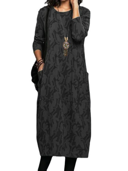 Stylish long black dress with abstract foliage pattern, long sleeves, round neckline