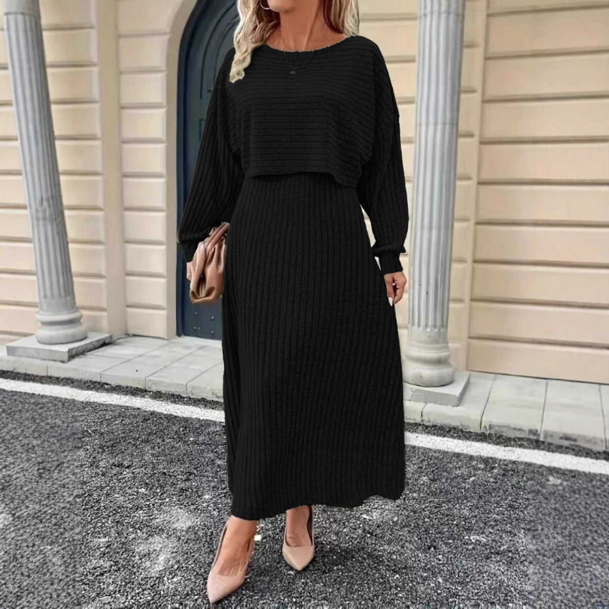 Black knit co-ord set with cropped long-sleeve top and fitted midi skirt