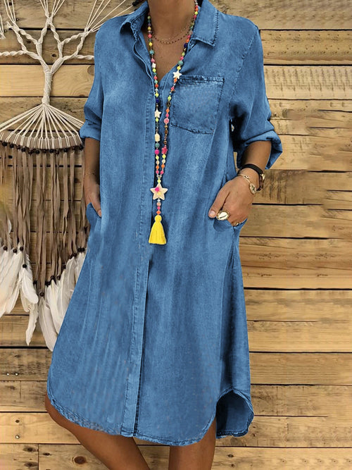 Medium blue denim shirt dress with chest pocket, button front, tassel pendant