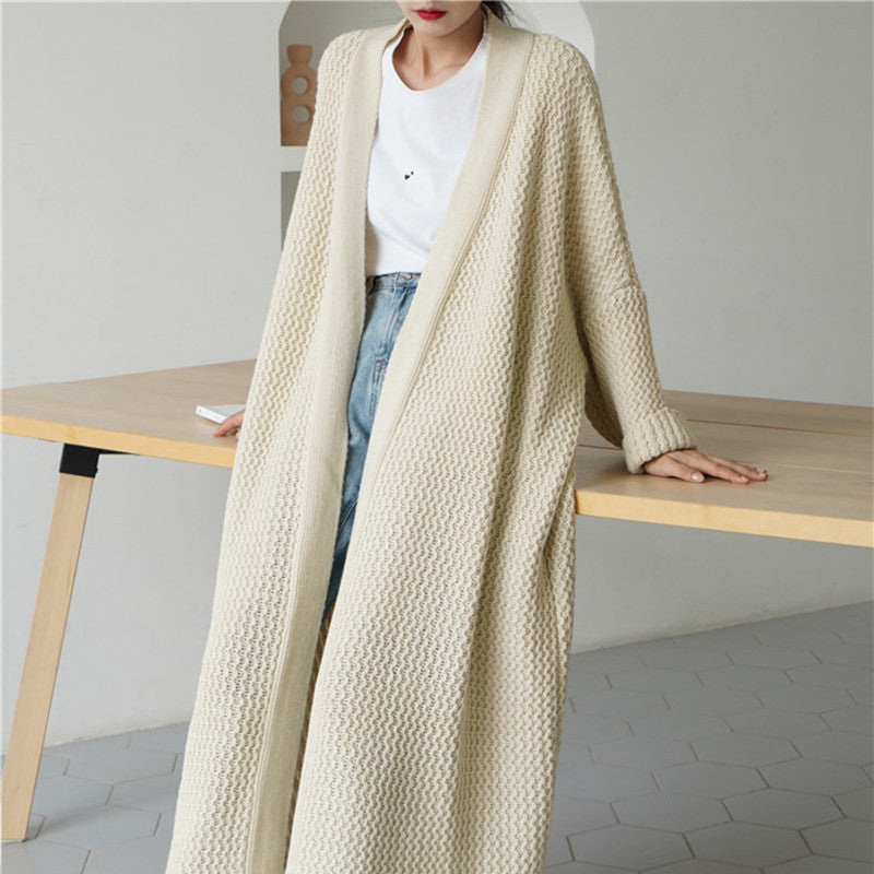 Beige textured knit cardigan with open front and long sleeves
