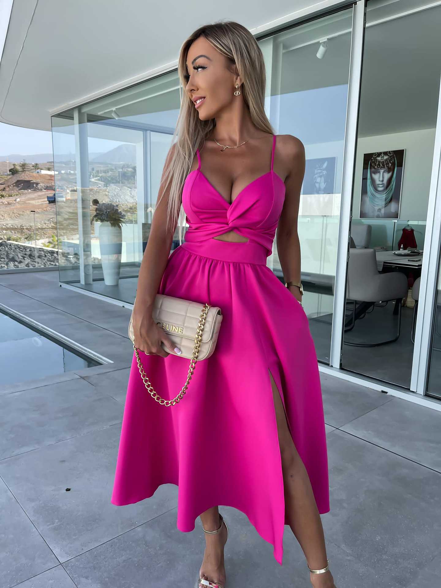 Stylish fuchsia pink midi dress with spaghetti straps, V-neck, knot waist, and high slit