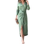Green midi shirt dress with button front, long sleeves, and tied waist