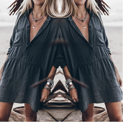 Relaxed loose dress, dark V-neck button-front with short puff sleeves and layered skirt